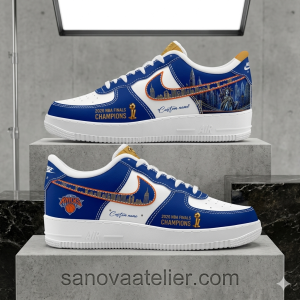 New York Knicks 2026 NBA Finals Champions Custom Air Force 1 Shoes 4 Front-facing product shot of the New York Knicks 2026 NBA Finals Champions Custom Air Force 1 Sneakers, showcasing the bold blue and white leather toe box, custom branding, and championship details displayed on a concrete studio platform with sanovaatelier.com text.