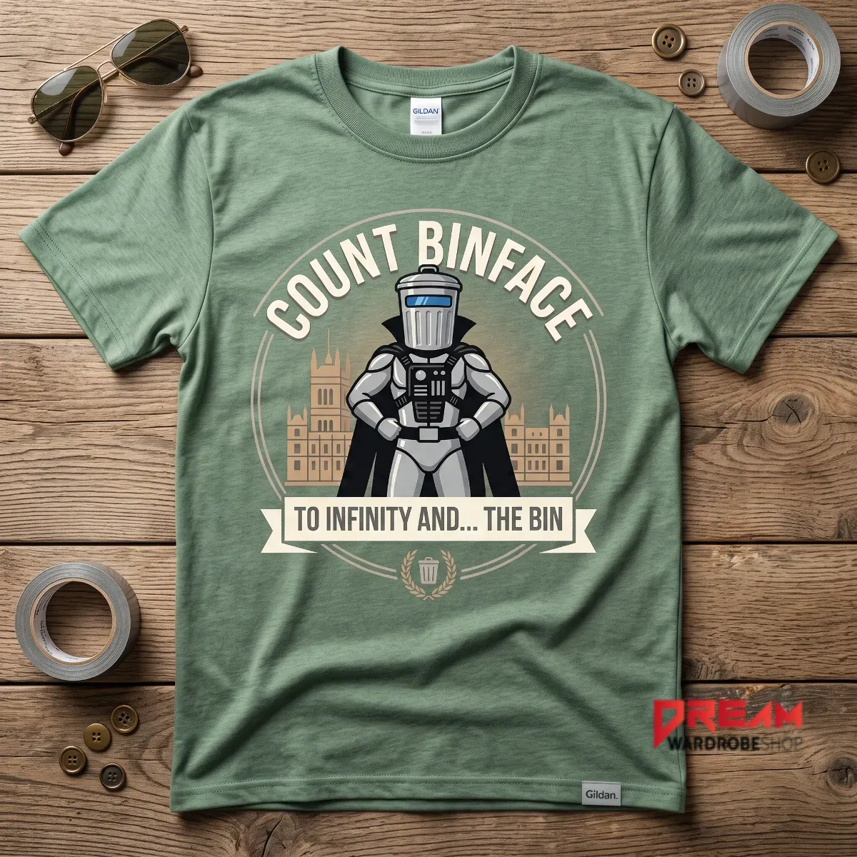 Count Binface satirical character illustration on a sage green cotton t-shirt