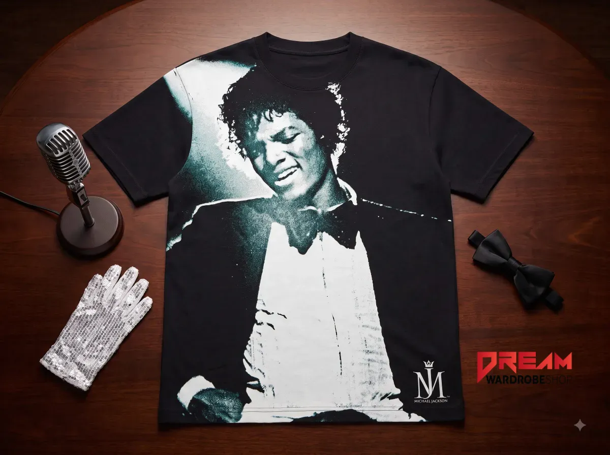 A black t-shirt showcasing a monochrome portrait of Michael Jackson on a wooden desk.
