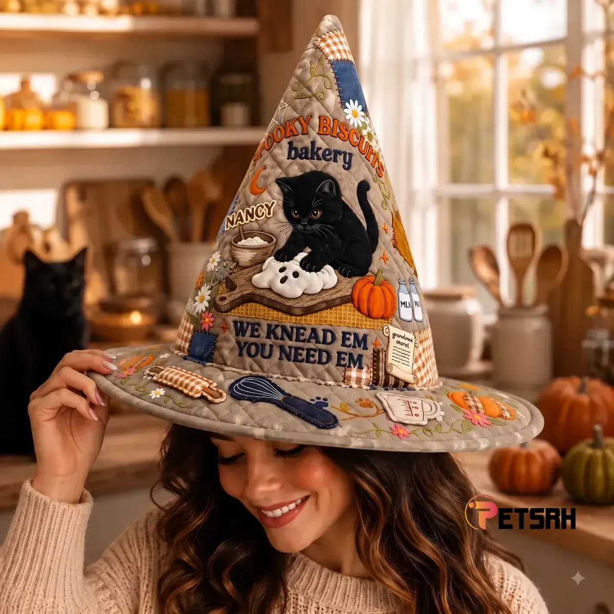 Spooky Biscuits Bakery Black Cat Witch Hat 4 Front view of a brown quilted fabric witch hat with a detailed Spooky Biscuits Bakery design featuring a black cat and autumn imagery. (Detail view #3)