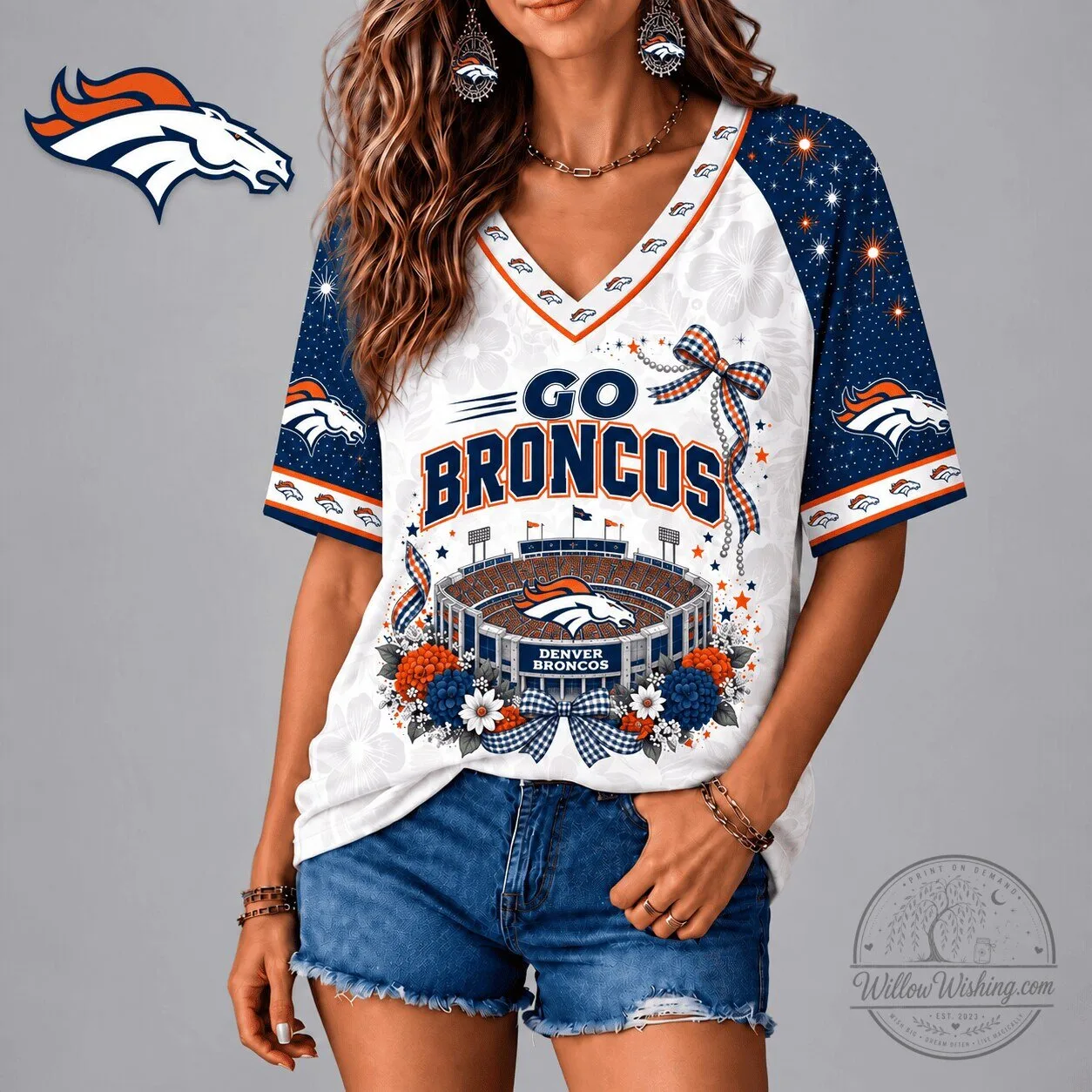 Denver Broncos Football Team Stadium Patriotic Floral Bow V-Neck T-Shirt 1 Denver Broncos Football Team Stadium Patriotic Floral Bow V-Neck T-Shirt