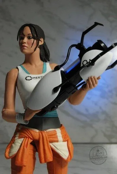 Portal 2 Chell Action Figure with Light-Up Aperture Science Handheld Portal Device